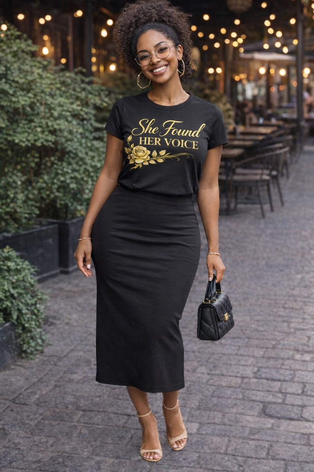 Black woman wearing She Found Her Voice t-shirt, empowerment apparel